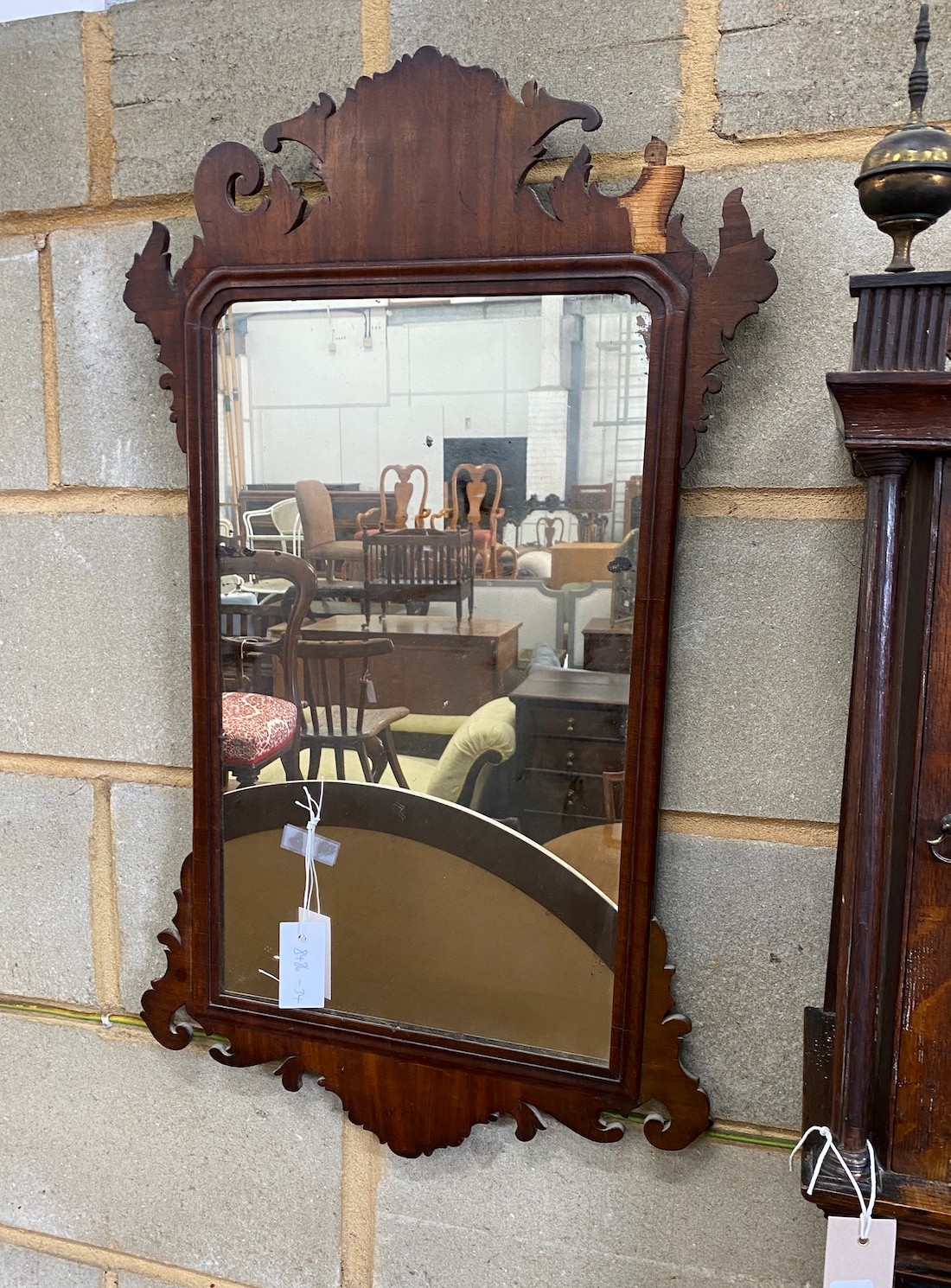 A George III style fret cut mahogany wall mirror, width 48cm, height 83cm